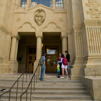 Students outside a building on the steps