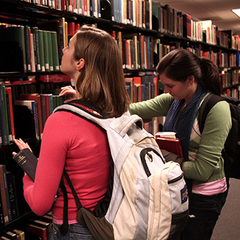 Two students searching for a book